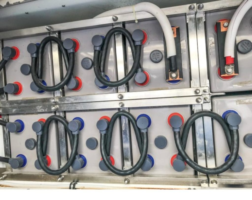 The old AGM batteries used up a fair chunk of space in the lazarette. Originally in A new spark, lithium batteries. // Photo credit: Lawrence Schäffler