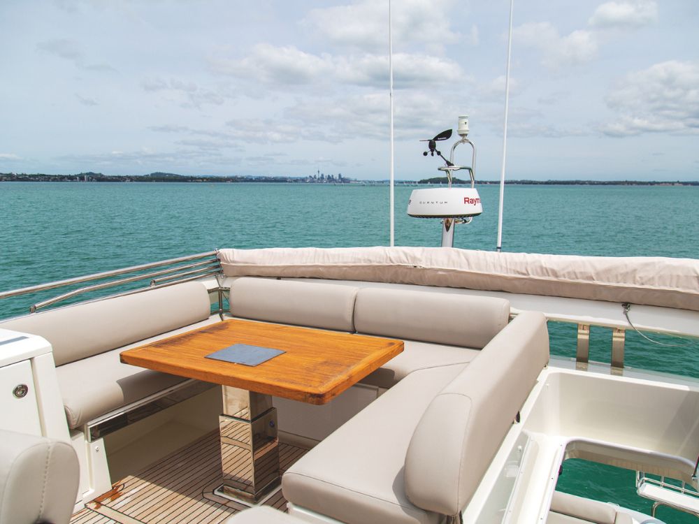 The Prestige 630S flybridge is also an outdoor lounge with a bimini top for sun protection.