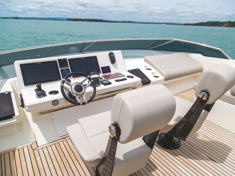 The flybridge helm station has a full complement of controls and displays.