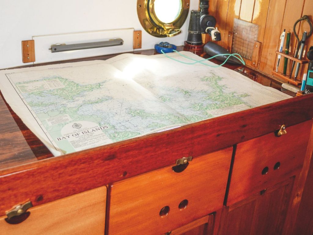 Plenty of recycled timber features in the boat’s interior; a decent-sized nav station; the heat from the wood burner enhances the cosy ambience