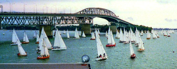 Over 100 Wright yachts lined up under the Auckland Harbour Bridge for the inaugural Alan Wright Day 41 years ago. // Photo courtesy of Alan Wright Over 100 Wright yachts lined up under the Auckland Harbour Bridge for the inaugural Alan Wright Day 41 years ago. // Photo courtesy of Alan Wright