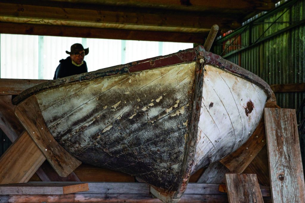 A strip-plank double-ended surfboat of Greek design awaiting restoration. Strip plank at Okains Bay Museum (Up the creek: Old boats heaven) // Photo credit: Lesley Stone