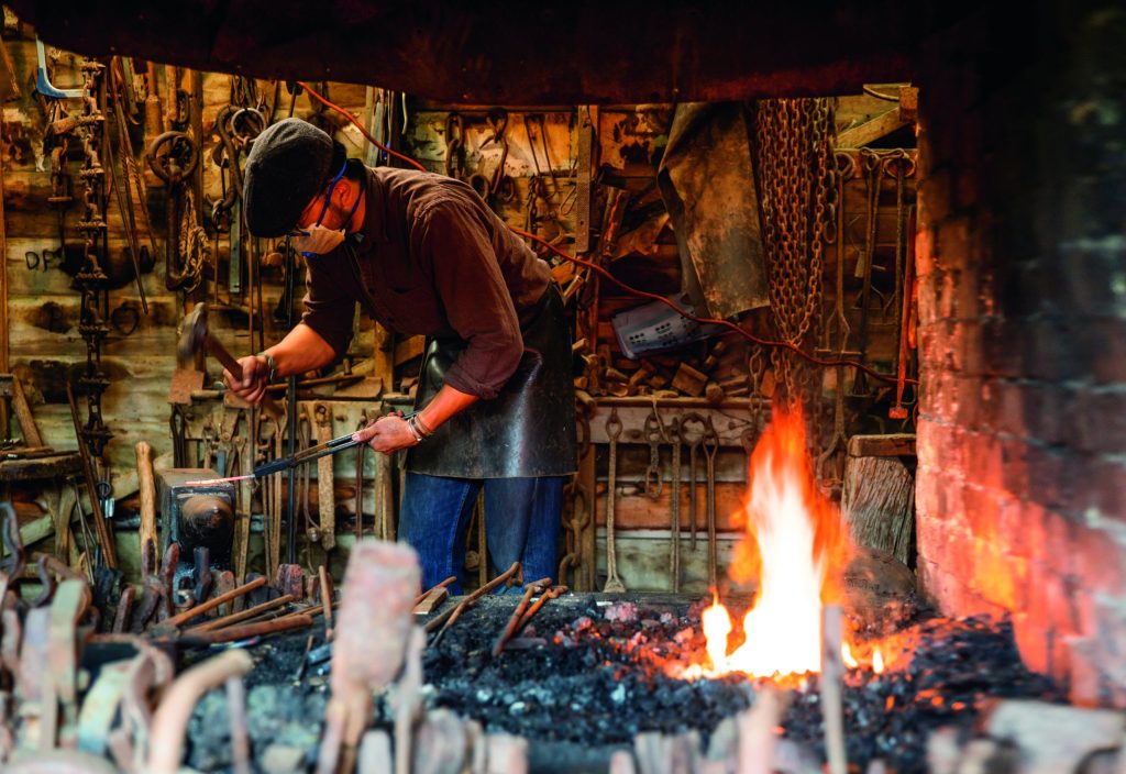 The blacksmith with his roaring furnace really hogged Lesley’s lens Blacksmith at Okains Bay Museum (Up the creek: Old boats heaven) // Photo credit: Lesley Stone
