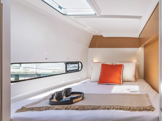 Guest cabin with generous berth; The owner&rsquo;s bathroom is vast with acres of white gelcoat that is easily wiped clean.