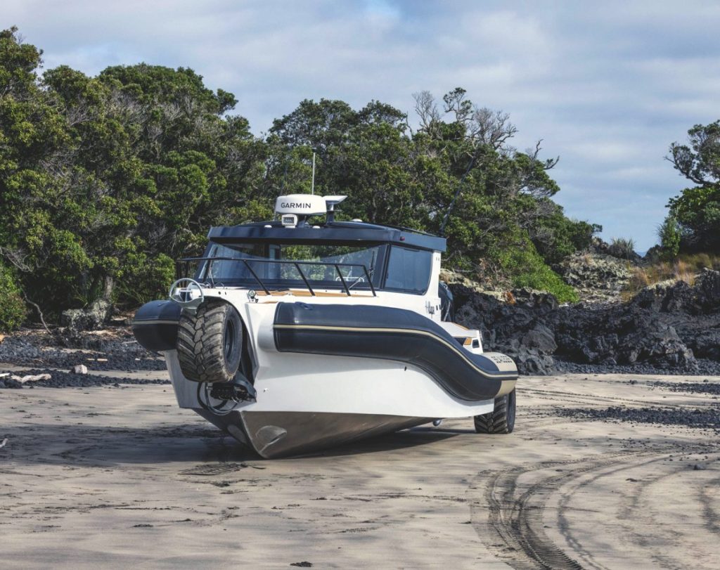 The full scale of the Sealegs 12RC is best appreciated on the beach. The surf rolling in on Takapuna Beach posed it no challenges. // Photo credit: Roger Mills / Boating New Zealand