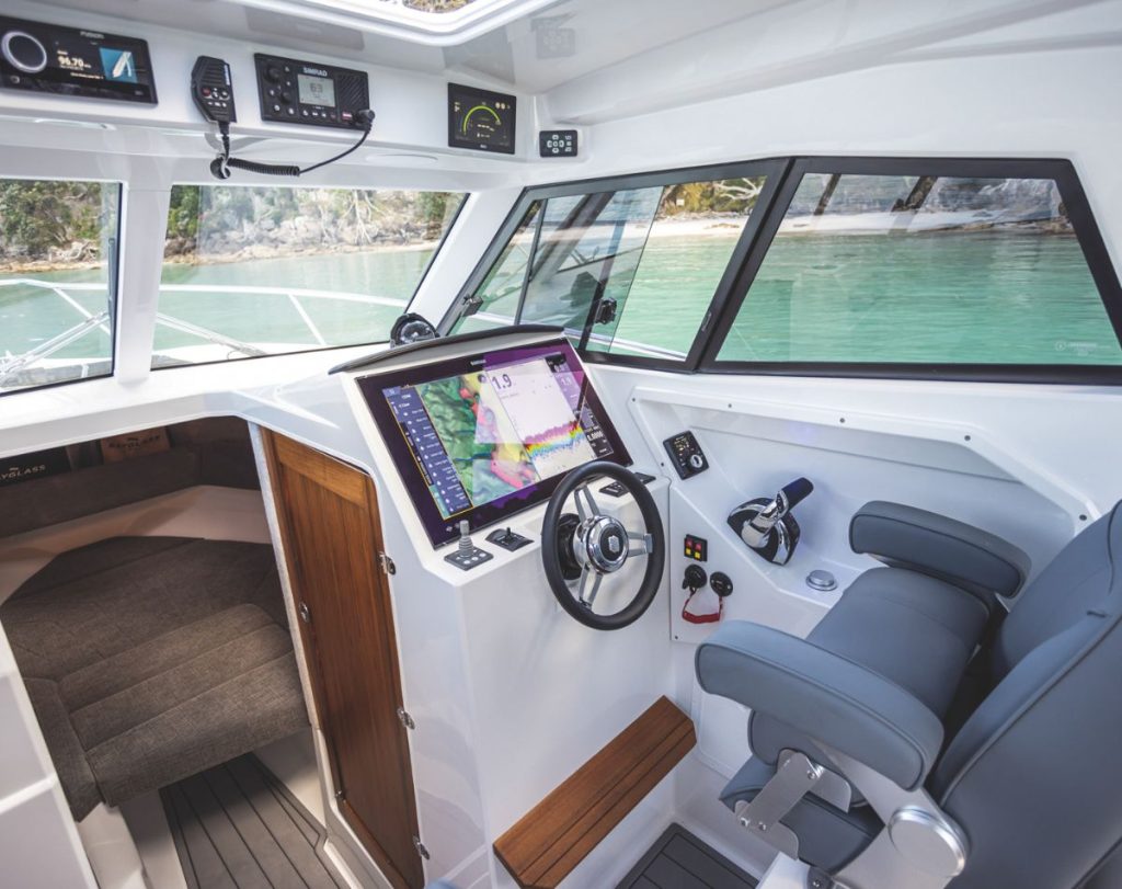 Clean, modern helm console has room enough for the latest large-screen MFDs, in this case by Simrad. // BNZ