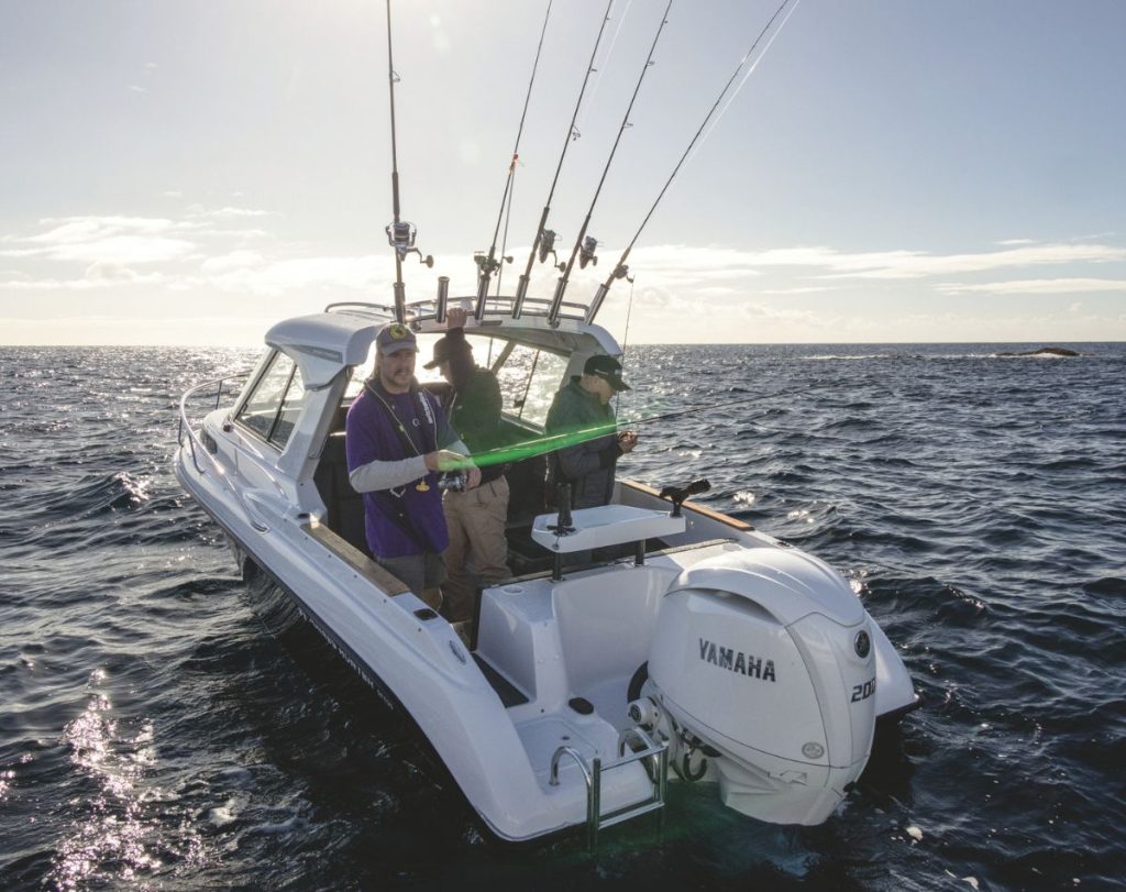 The Haines Hunter SP635 cockpit feels safe when fishing while the hardtop offers shelter. // Roger Mills