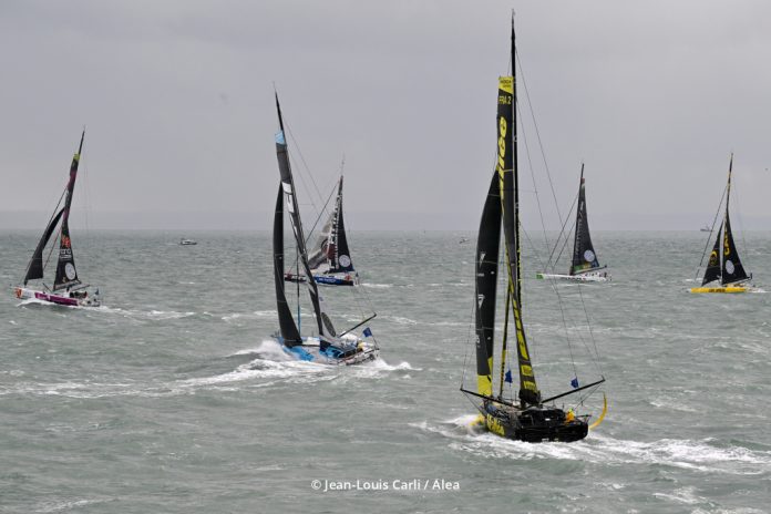 Start line of the 2025 Transat Café L'OR. The IMOCA Fleet sail out. Photo credit Jean-Louis Carli:Alea