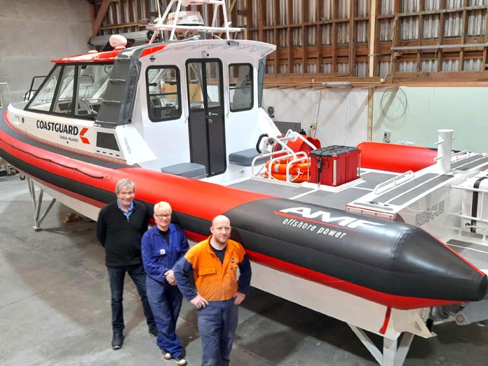 Brian, his wife Jodi, and Ryan Cameron ‘boat builder extraordinaire.’ Photo credit: River City Press.