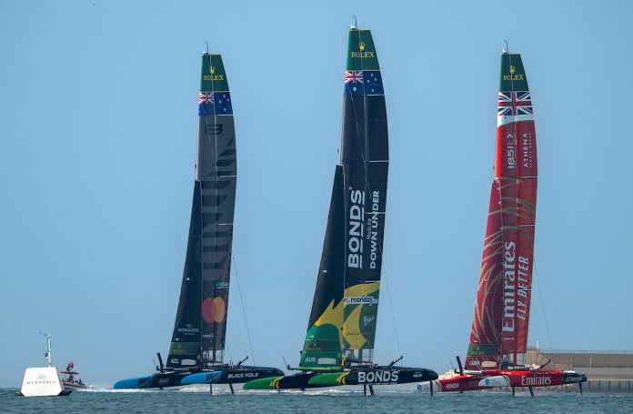 Black Foils SailGP Team helmed by Peter Burling, BONDS Flying Roos SailGP Team helmed by Tom Slingsby and Emirates Great Britain SailGP Team helmed by Dylan Fletcher in the season final on Race Day 2 of the Mubadala Abu Dhabi Sail Grand Prix 2025 Season Grand Final presented by Abu Dhabi Sports Council held in Abu Dhabi, United Arab Emirates, Sunday 30 November 2025. Rolex SailGP Championship Event 12 2025 Season. Photo credit: Ricardo Pinto for SailGP.