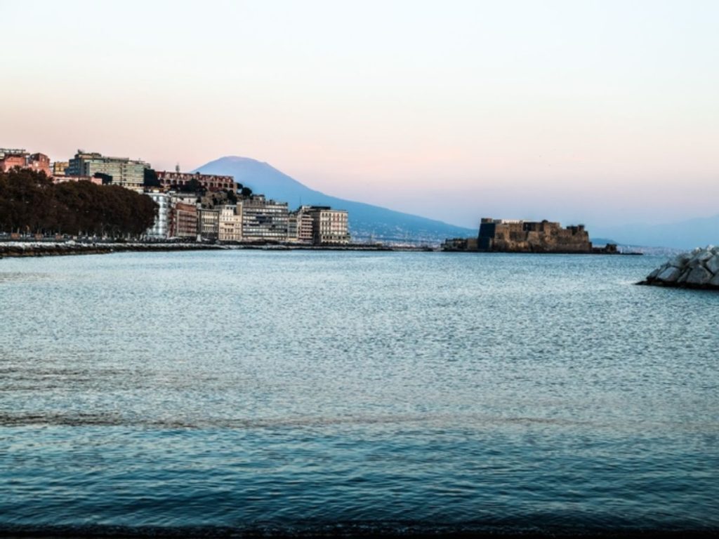 View of Naples with Castel dell'Ovo and Mount Vesuvius in the background. // Photo credit: Stefano Albamonte / Comune di Napoli / America's Cup