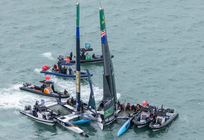 Aftermath of the collision between the Black Foils SailGP Team helmed by Peter Burling and DS Automobiles SailGP Team France helmed by Quentin Delapierre, with support boats of the SailGP Fleet, on Race Day 1 of the ITM New Zealand Sail Grand Prix in Auckland, New Zealand. Saturday 14 February 2026. Rolex SailGP Championship Event 2 2026 Season. Photo: Simon Bruty for SailGP.