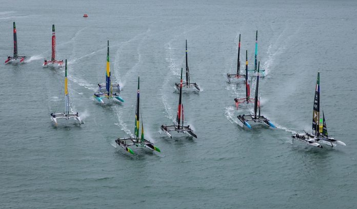 The SailGP F50 catamaran fleet with the Auckland Harbour Bridge in the background, on Race Day 1 of the ITM New Zealand Sail Grand Prix in Auckland, New Zealand. Saturday 14 February 2026. Rolex SailGP Championship Event 2 2026 Season. // Photo credit: Simon Bruty for SailGP.