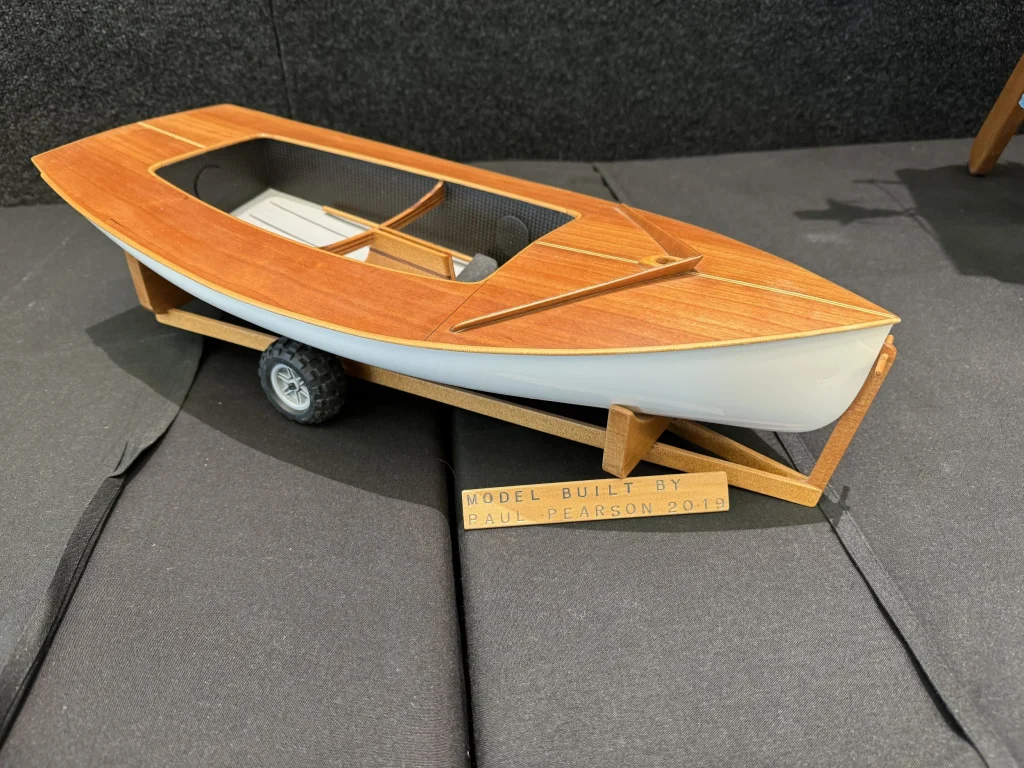 To-scale model of a Zephyr dinghy on display at the 2025 Auckland Wooden Boat Show Festival. // Supplied