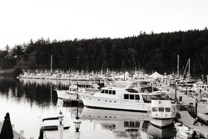 Line-up of old boats // Photo credit: Grand Banks Yachts (Grand Banks celebrates 70 years of pioneering long-range cruising yachts)