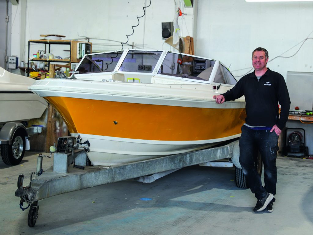 Mike Bamber with a Sea Nymph under restoration for a customer