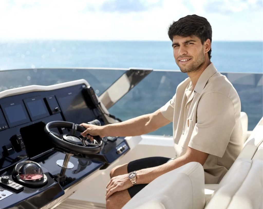 Carlos Alcaraz sits at the helm of a Sunreef Yacht // Photo credit: Sunreef