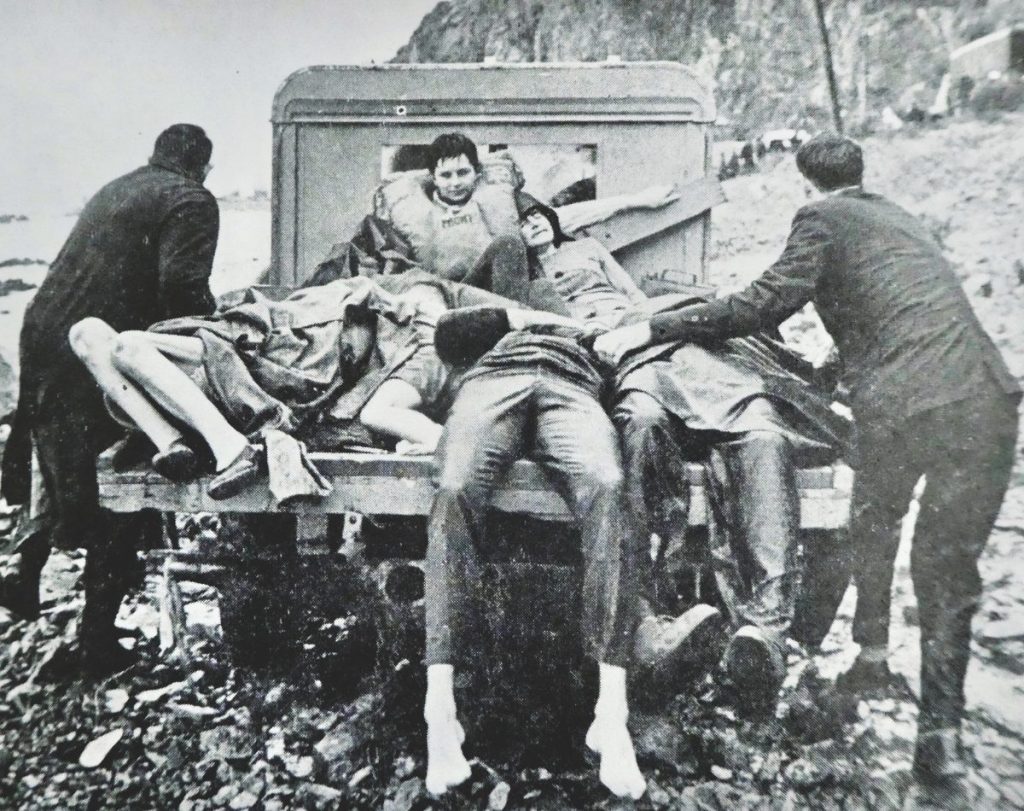 A four-wheel-drive vehicle carries them to safety. Zephyr sailor Sue Currie is sitting upright on the flatdeck.