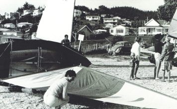 Sue Currie fitting a borrowed sail to her Zephyr – her original was lost in her hand luggage with Wahine.