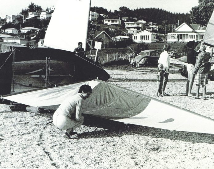 Sue Currie fitting a borrowed sail to her Zephyr – her original was lost in her hand luggage with Wahine.