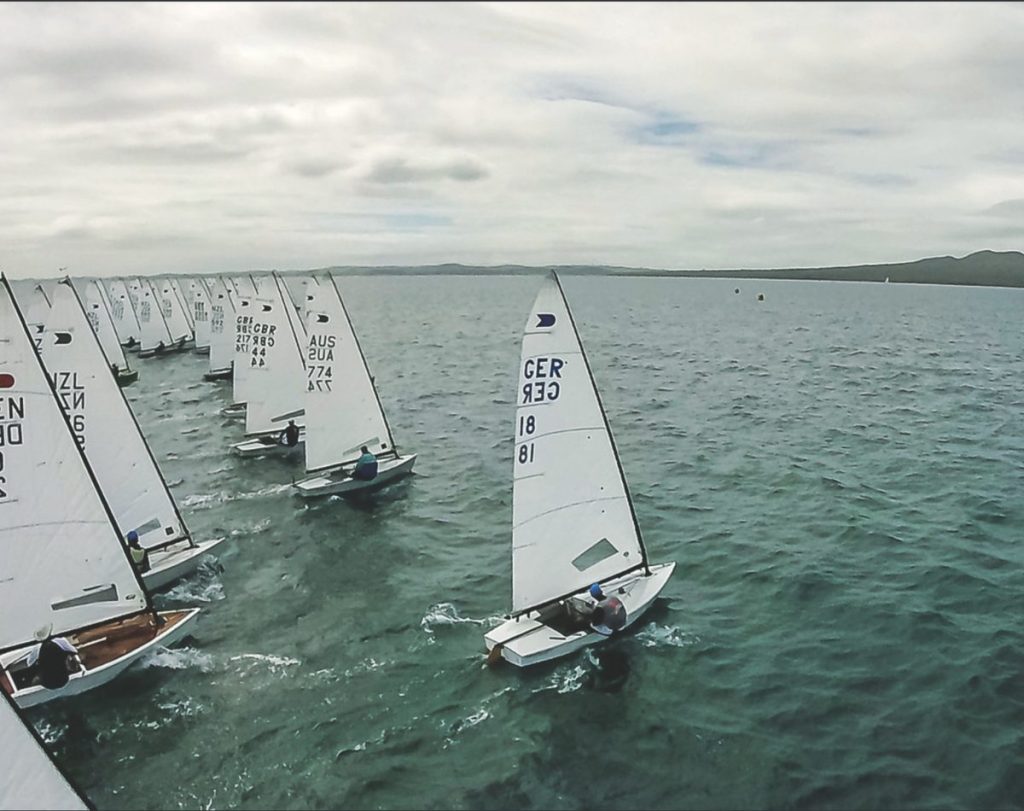 The start of an OK Worlds race off Takapuna 2019. 