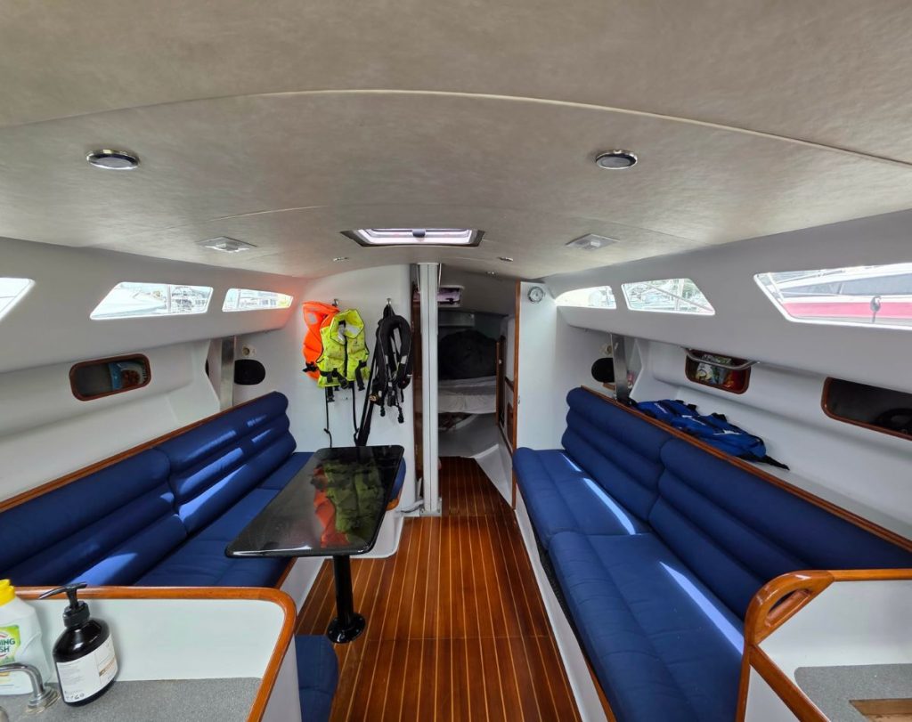 Saloon layout with long settees either side, ideal for crew offshore or relaxed time at anchor. // Supplied