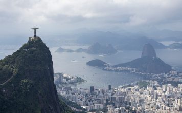 Emirates GBR are out of the finals in SailGP Rio Christ the Redeemer and the Rio de Janeiro skyline, on Race Day 2 of the ENEL Rio Sail Grand Prix in Rio de Janeiro, Brazil. Sunday 12 April 2026. Rolex SailGP Championship Event 4 2026 Season. // Photo credit: Gabriel Heusi for SailGP.