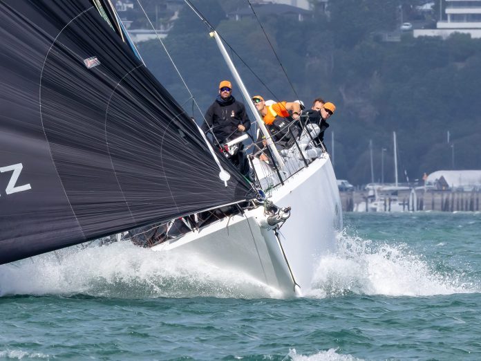 Steve Mair firmly at the helm of his Shaw 12, Clockwork // Photo credit: Roger Mills / Boating New Zealand