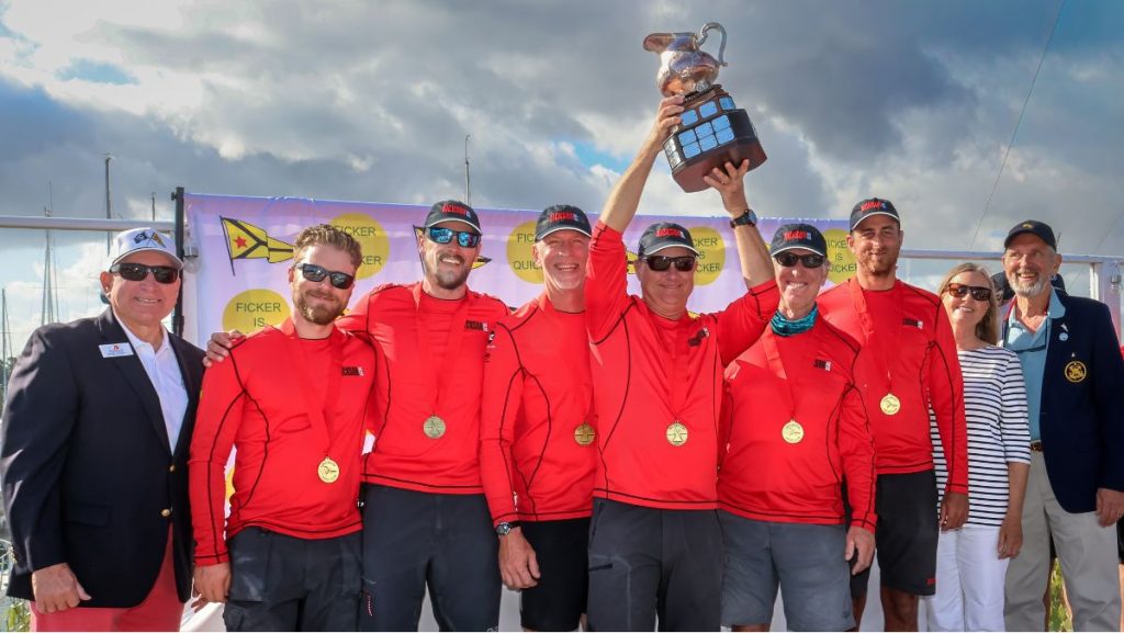 LBYC Commodore Bob Piercy (far left), Deon McDonald and Ficker Cup Chair Tom Camp (far right) congratulate Skipper Scotty Dickson (holding trophy), Steve Flam, Garrett Brown, Danny Bailey, Jackson McCoy, and Tony Stuart // Photo credit : Bronny Daniels / LBYC