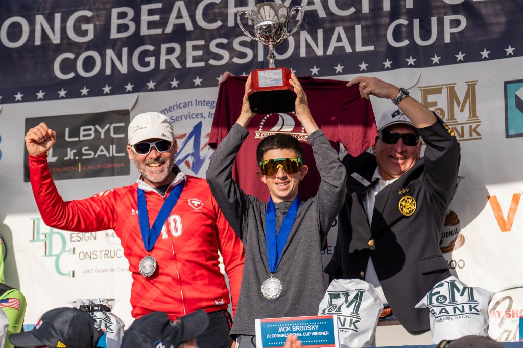 Winner of the Junior Congressional Cup Jack Brodsky with Eric Monnin and LBYC Commodore Bob Piercy. 2026 LBYC Congressional Cup, Junior Congressional Cup. Long Beach Yacht Club, Long Beach, CA. May 01, 2026. // Photo credit: Ian Roman / WMRT