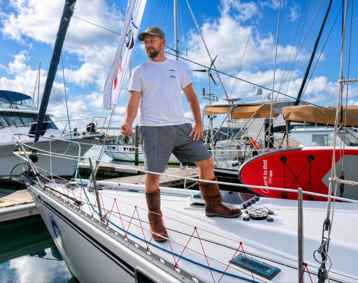 Ben Ball standing on the deck of Camellia his 1976 Cavalier 36 which he will sail solo from Opua to Southport, Gold Coast in the 2026 Solo Trans-Tasman Yacht Challenge. // Photo credit: Boating New Zealand