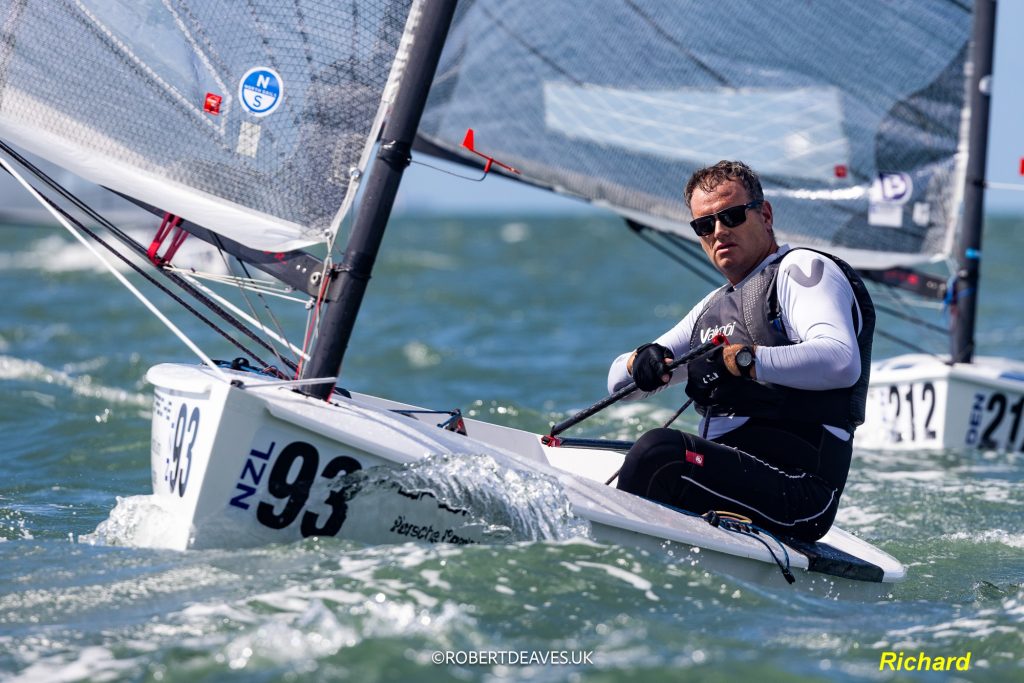 Richard Hawkins at the helm of NZL93, NZ Finn Team. // Photo credit: Robert Deaves