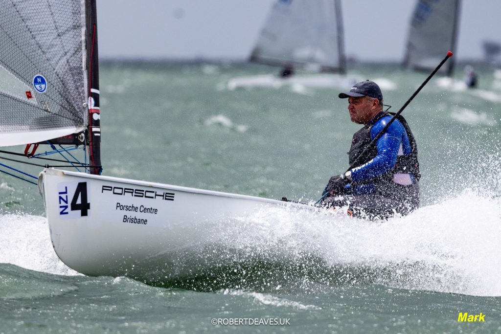 Mark Perrow at the helm of NZL4, NZ Finn Team // Photo credit: Robert Deaves