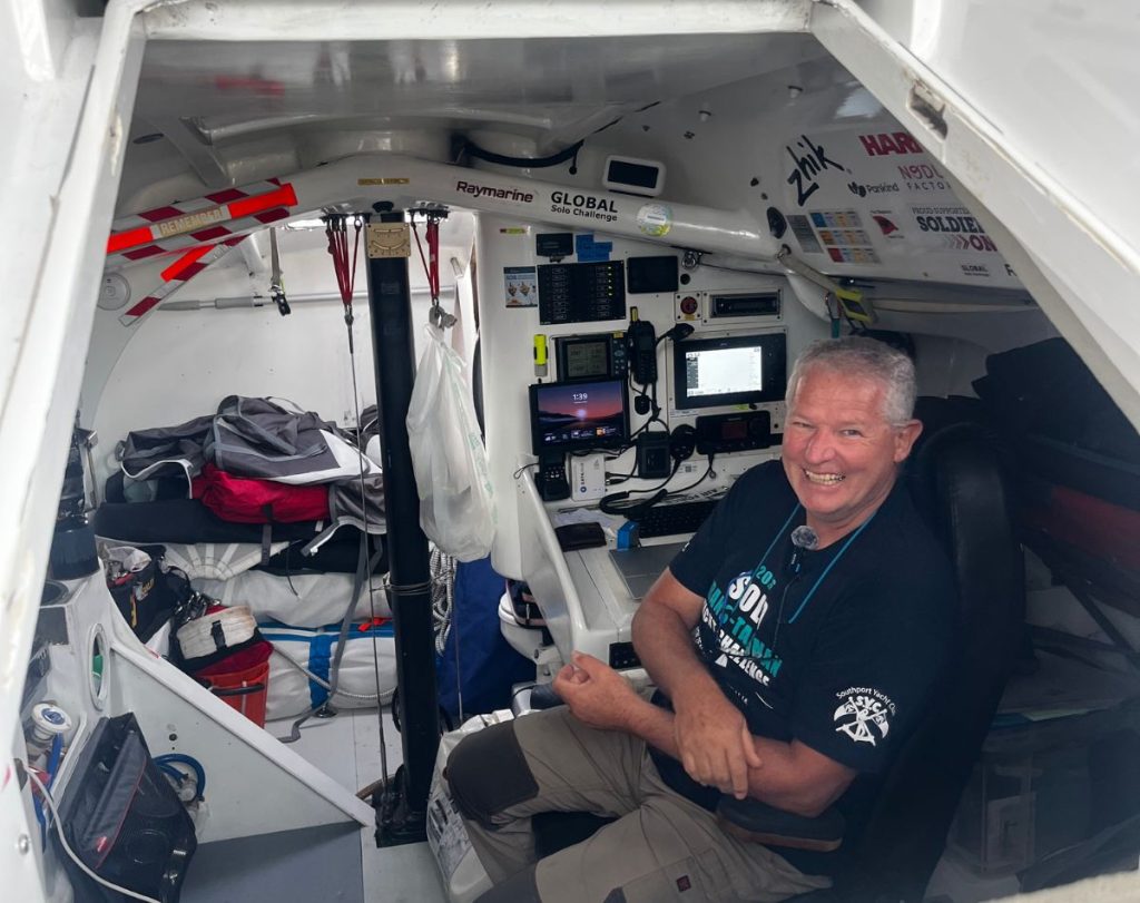 Kevin Le Poidevin sitting below in his Open 40 Roaring Forty before the start of the 2026 Solo Trans-Tasman Yacht Race. // Photo credit: Kirsten Thomas