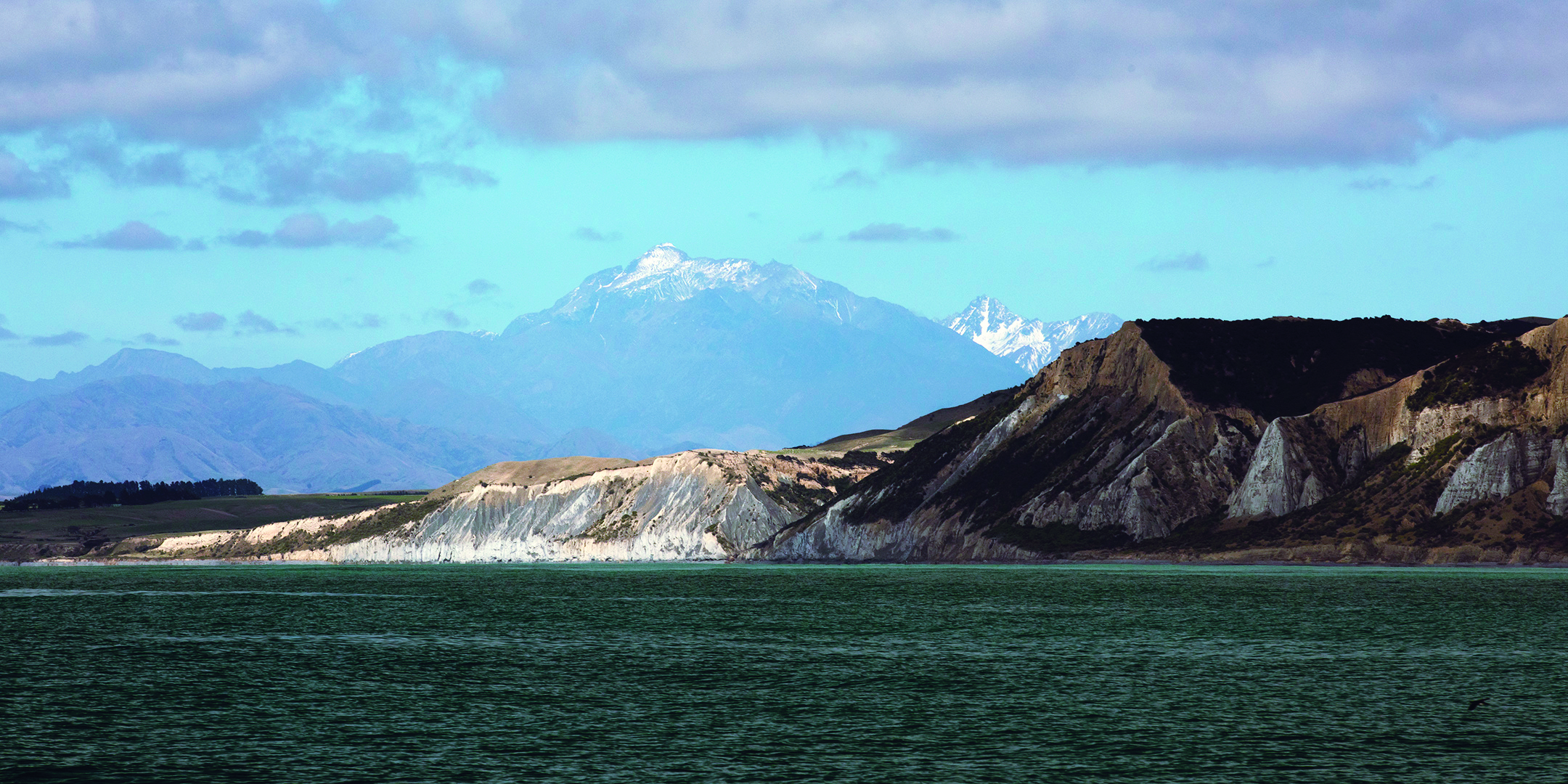 Flags mark mooring access in the Marlborough Sounds; Cloudy Bay. // Photo credit: Alex and Lesley Stone