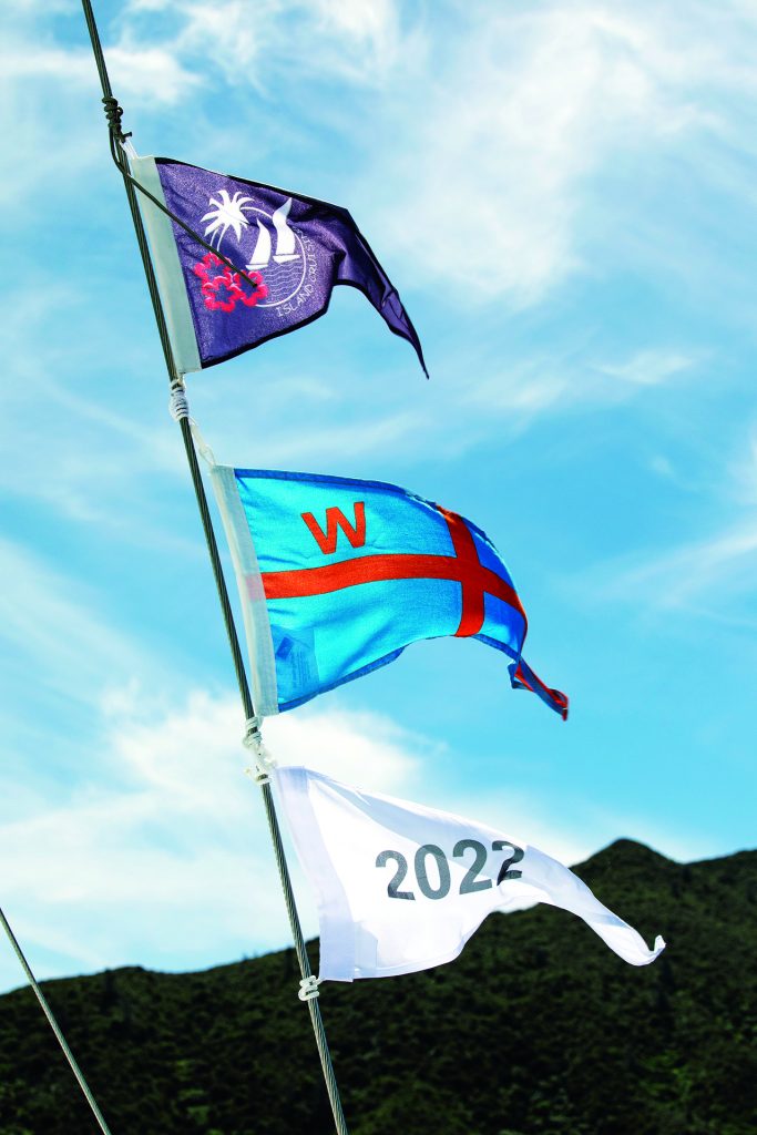 Flags mark mooring access in the Marlborough Sounds; Cloudy Bay. // Photo credit: Alex and Lesley Stone