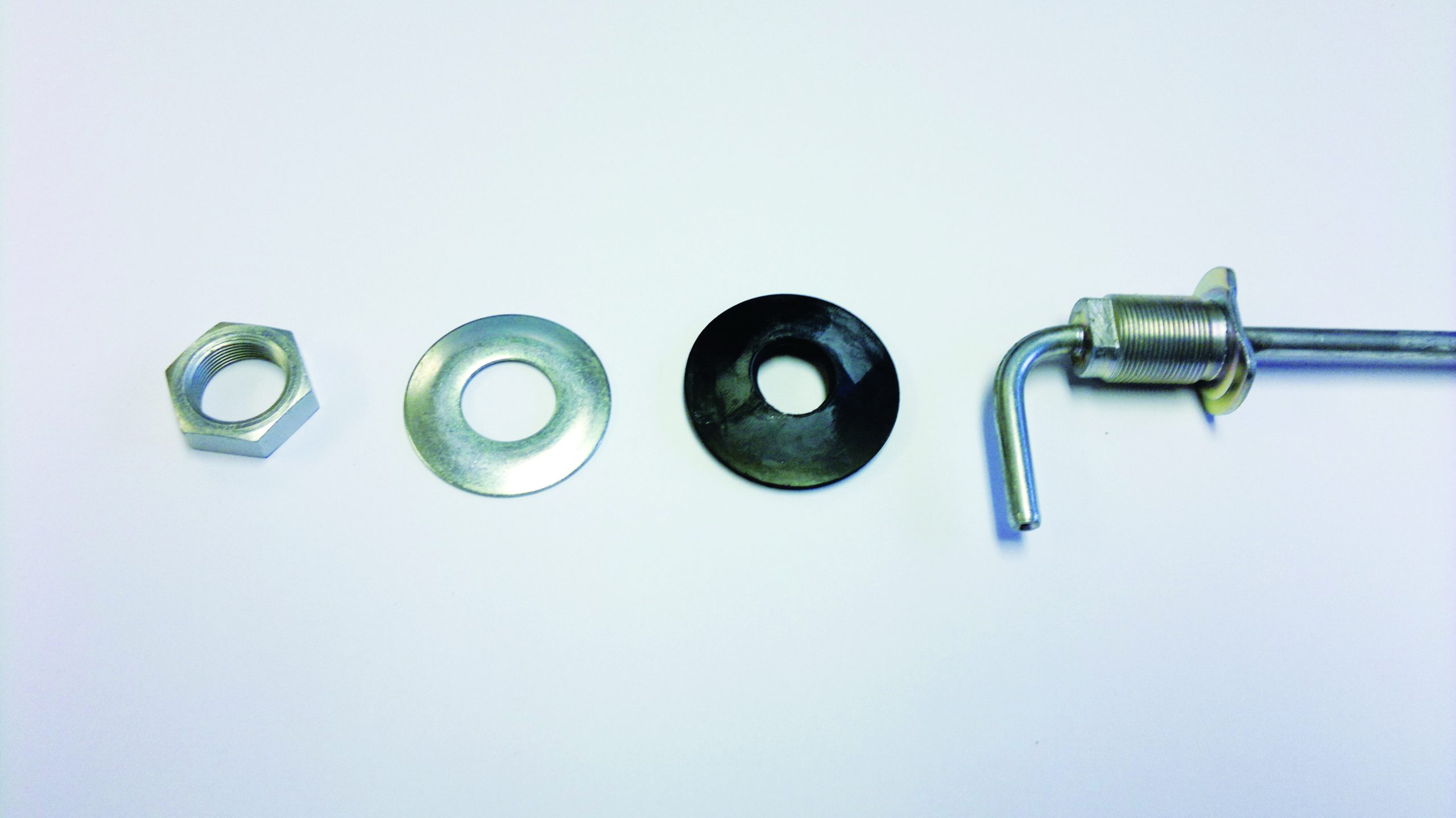 I can see metal hardware components including a nut, washers, and what appears to be a threaded rod or bolt assembly, but this appears to be a close-up of mechanical parts rather than a boating scene with vessels or marine action // Photo credit: supplied.