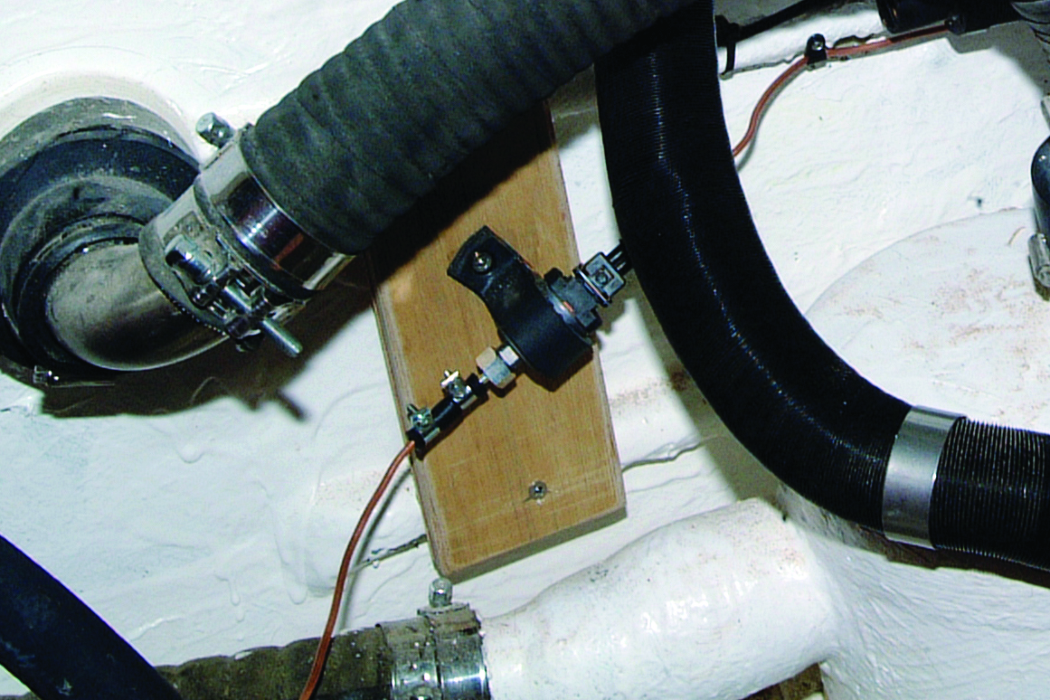 A close-up view of mechanical equipment and wiring components inside what appears to be a boat's engine compartment or technical area // Photo credit: supplied.