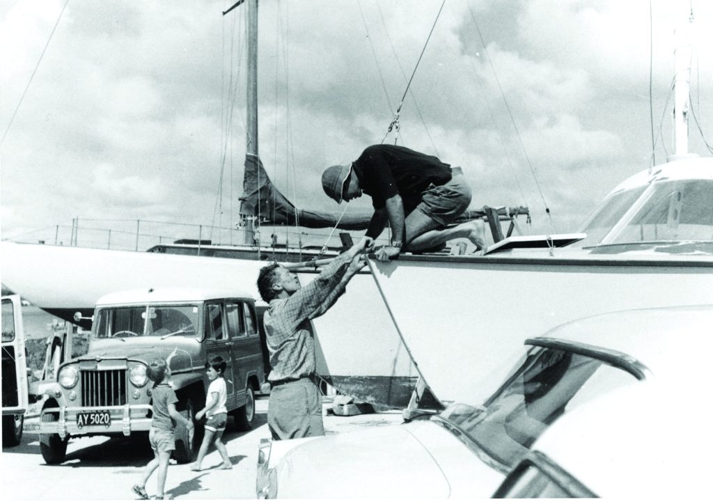 Te Ngeru in 1969. John Chapple (right) while Simon Kidd (left) plays with Bryn Chapple in front of John’s Jeep. // Photo credit: Harold Kidd
