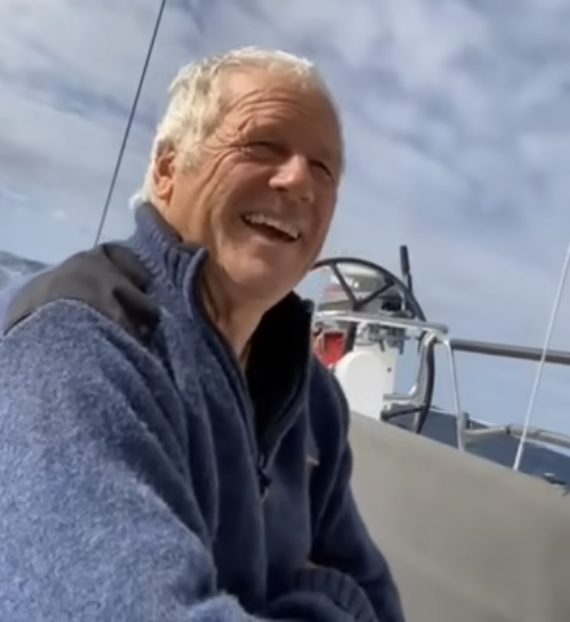Terry Dunn on Nautilass, looking back over the Challenge while enjoying the sun on his transom. // Photo credit: Solo Trans-Tasman Yacht Challenge