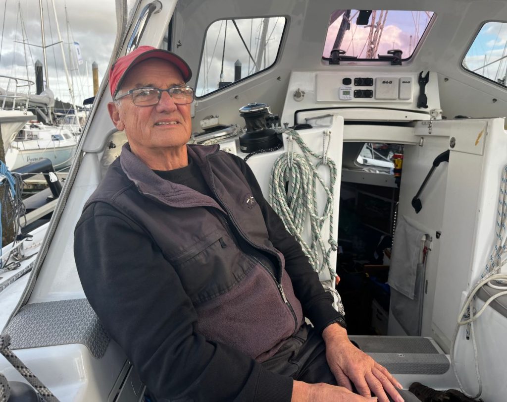 Peter Nobbs sitting in Smoko's cockpit before the start of the 2026 Solo Trans-Tasman Yacht Challenge // Photo credit: Kirsten Thomas