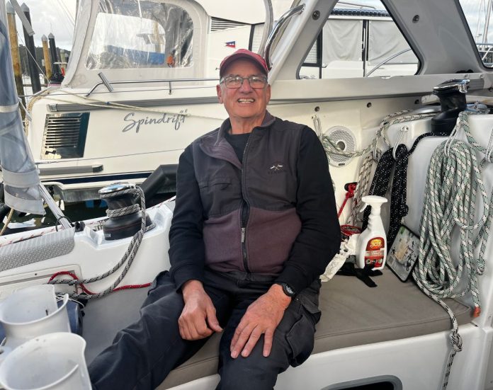 Peter Nobbs sitting in Smoko's cockpit before the start of the 2026 Solo Trans-Tasman Yacht Challenge // Photo credit: Kirsten Thomas