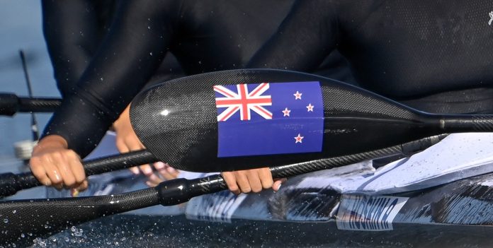 flag-on-paddle-scaled-1 Photo credit: Canoe Racing New Zealand
