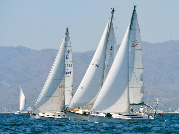 Pre-start, Nereid (foreground) puts a squeeze on some of the competition in the build-up to race one. Banderas Bay Regatta – flying the Kiwi flag in Mexico's biggest Race Week. // Photo credit: Steve Raea