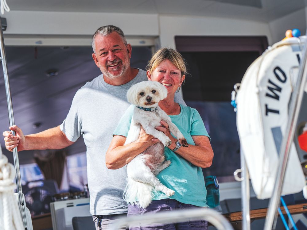 Mark and Penny Belcher with their Maltese Benji. // Photo credit: Theresa Nicholson