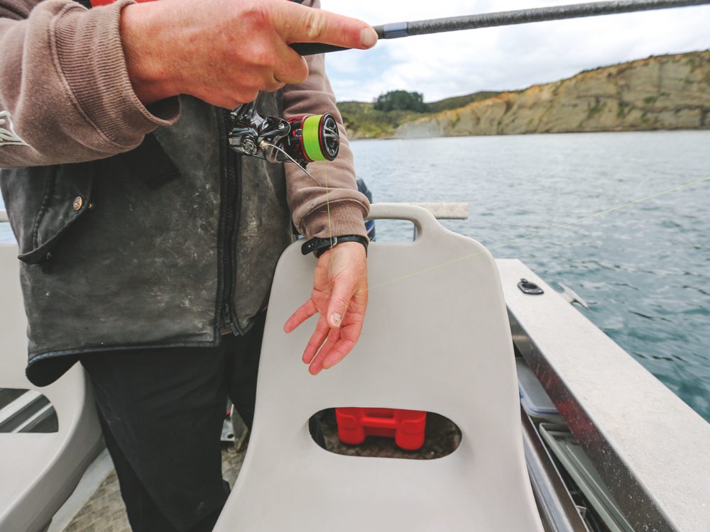 Pushing your thumb and forefinger downwards onto the reel's spiralling line tightens it and drops the lure into the water more quickly. // Supplied
