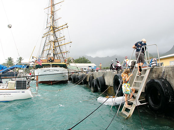 Negotiating the seawall in Avatiu Harbour as the washing machine churns below.