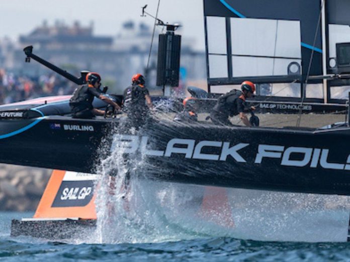Black Foils SailGP Team driven by Peter Burling in action as they race past the grandstand on Race Day 1 of the Spain Sail Grand Prix in Valencia, Spain. Saturday 5 September 2026. Rolex SailGP Championship Event 10 2026 Season. // Photo: Samo Vidic for SailGP.
