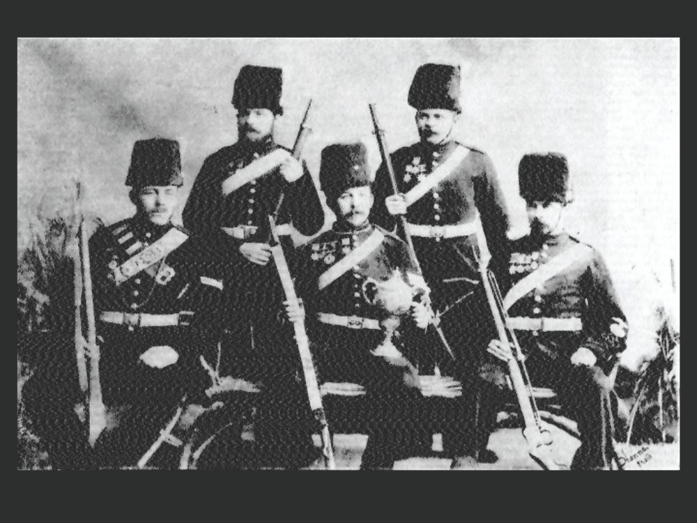 The 'A Battery' Champion Team 1890-1, with their Martini-Henrys, Josiah Webster standing, right.