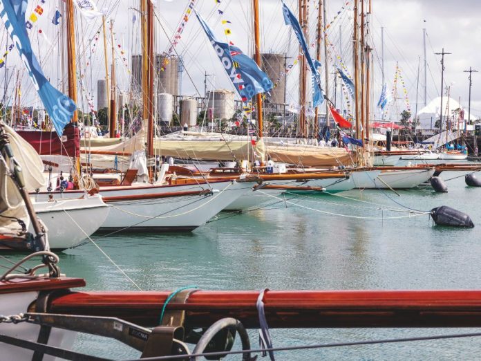 A classic line-up at the 2026 Auckland Wooden Boat Festival. // Photo credit: Roger Mills